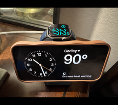 Store-supplied sample image of a charcoal charging station with a phone in landscape and a smartwatch